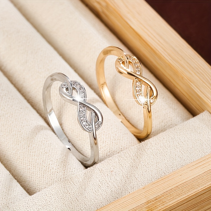 Golden Tone Infinity Symbol Ring with Zirconia Stones